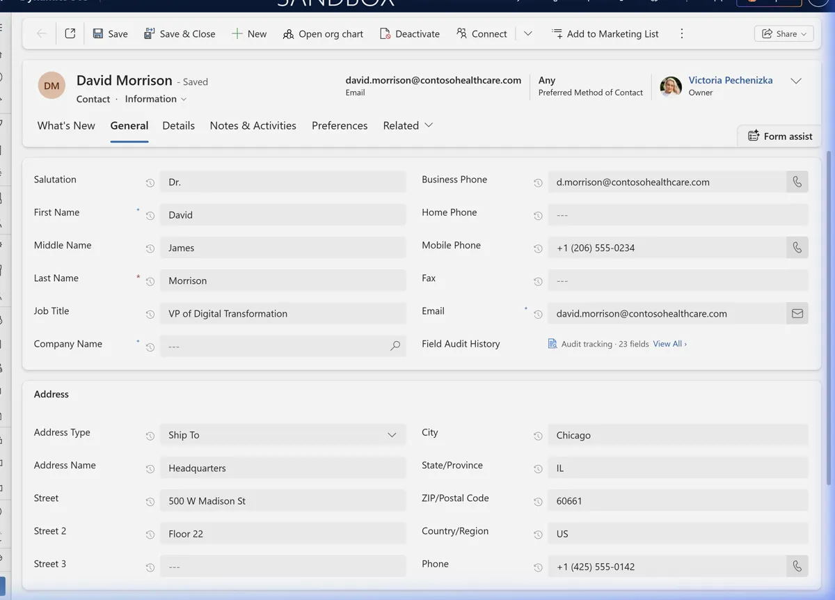 Dynamics 365 form with clock icons next to every audited field label — Email, Job Title, Company Name, and more